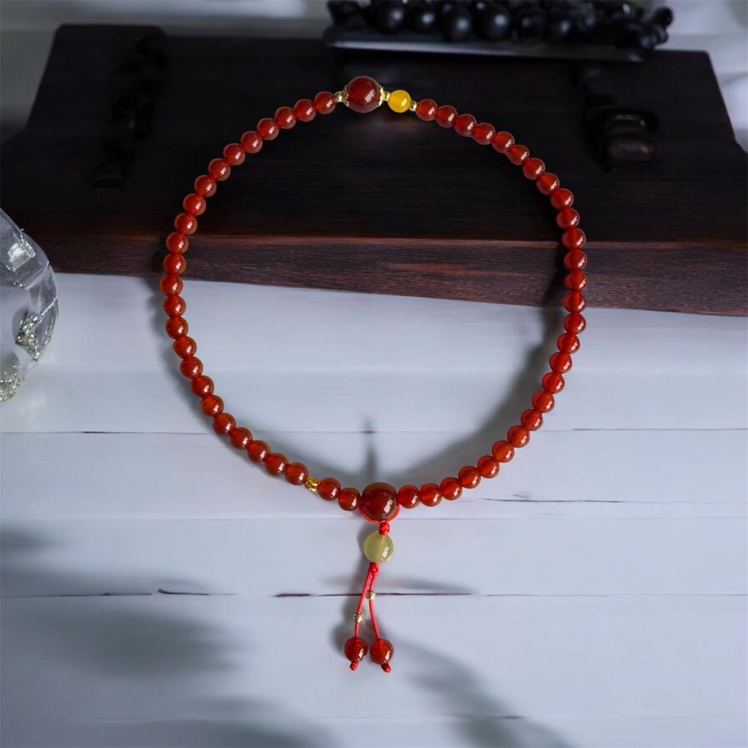 Auspicious Stone Bracelet "Red Agate Lucky Tassel" Red Agate with Auspicious Tassel Design, Enhances Good Fortune, Protective Power, and Success. Code N0006.