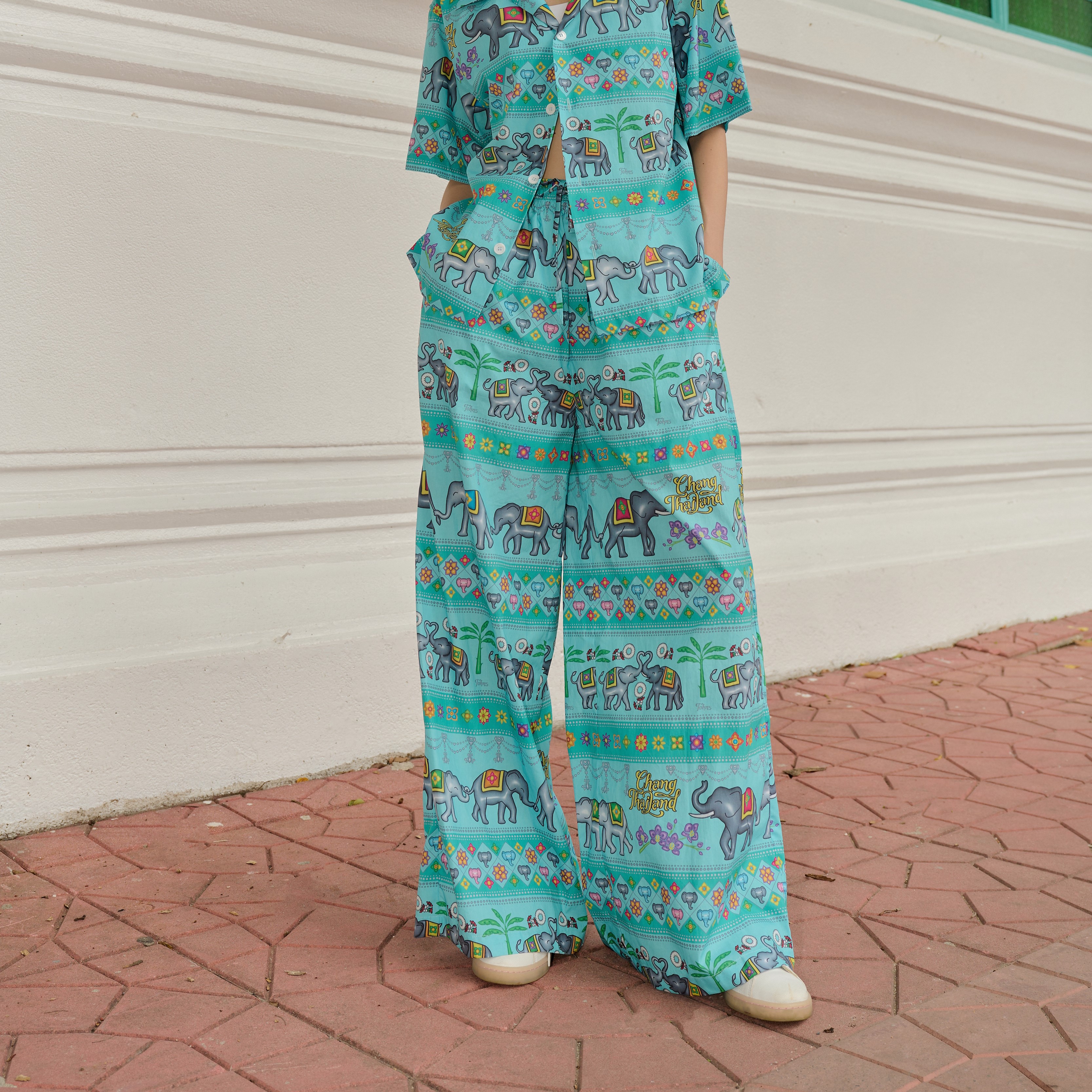 Tohns Journey in Thailand Pants, Elephant-Printed Trousers, Color: Ocean, Cotton Poplin Fabric, Soft and Comfortable. Good Ventilation, Not Stuffy, Loose Fit, Elastic Waist, Drawstring, Side Pockets. Long Enough to Cover the Ankles. ราคา 1,590 บาท*ส่งฟรี