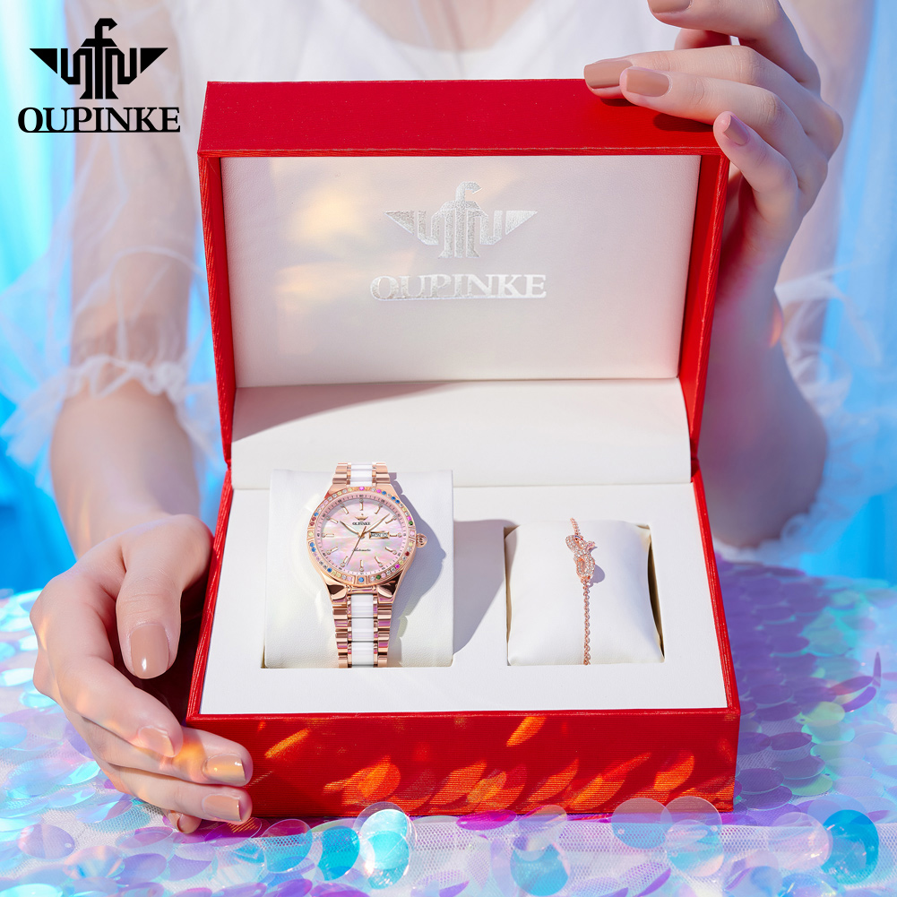 PLAYBOY/OUPINKE authentic brand women's watch 2024 new luxury diamond-encrusted dual calendar mechanical watch life waterproof 50 meters pink watch set box gift ราคา 7,999 บาท*ส่งฟรี