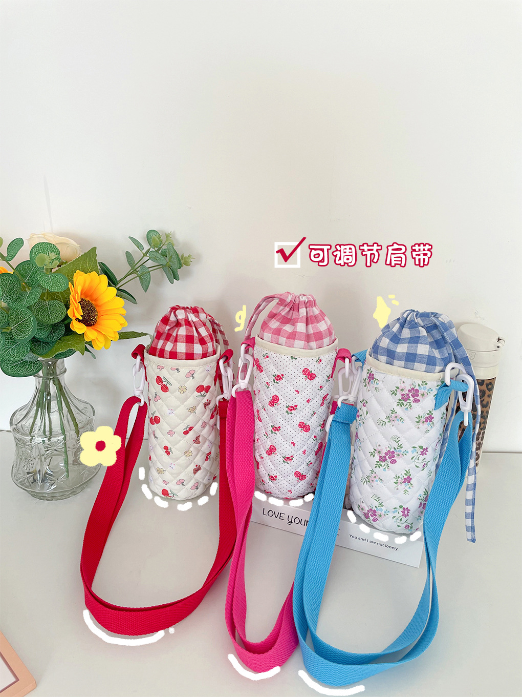 กระติกน้ำร้อนสำหรับเด็กน่ารักสไตล์เกาหลีที่หุ้มถ้วยใช้ได้ทั่วไปที่หุ้มถ้วยน้ำแบบไขว้ปรับได้สีตัดกันลายสก๊อตกระเป๋าถังกลม ราคา 159 บาท*ส่งฟรี